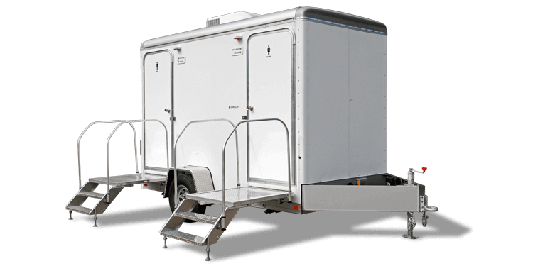 Luxury restroom trailer with steps and railing for a wedding venue
